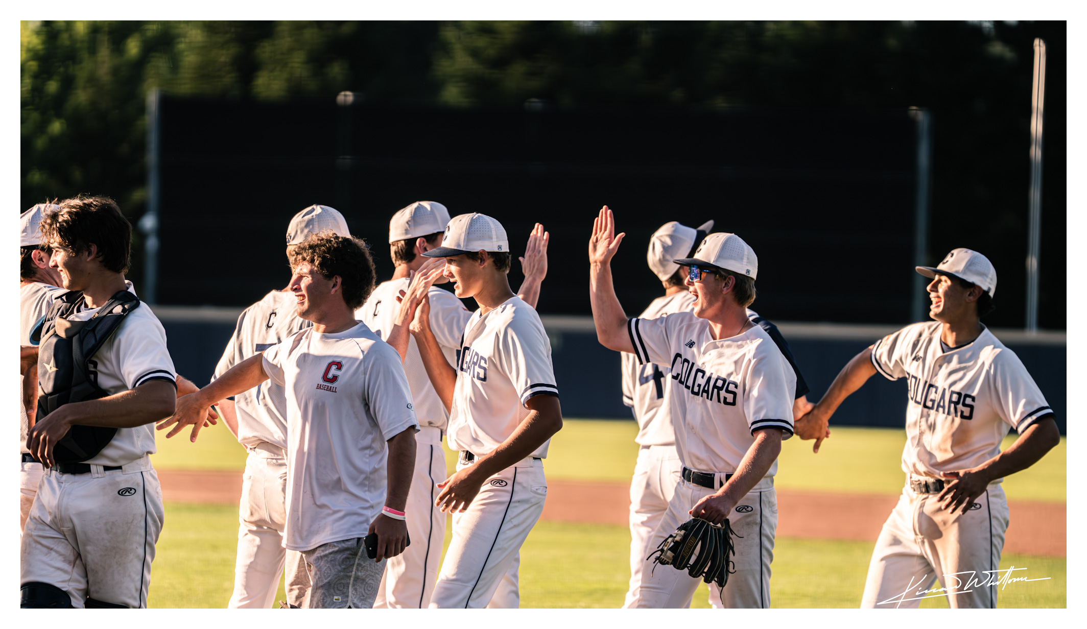 Baseball team line-up at sundown